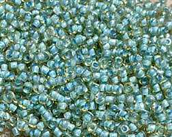 8/0 Topaz Lined Aqua Seed Bead - 10 grams